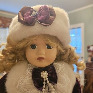 Porcelain doll by Camellia Garden 1997 collectible in adorable purple suit